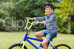 Portrait of smiling boy riding a bicycle