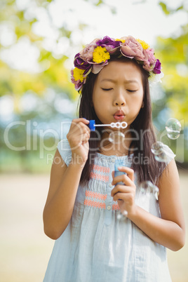 Girl blowing bubble wand