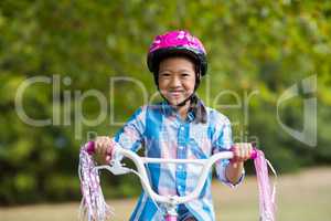 Portrait of smiling girl riding a bicycle