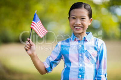 Girl holding an American flag