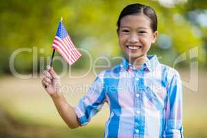 Girl holding an American flag