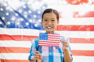 Young girl holding American flag