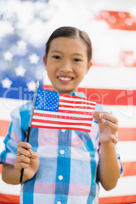 Young girl holding American flag