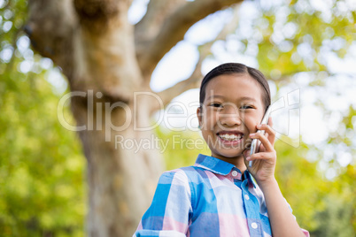 Portrait of smiling girl talking on mobile phone