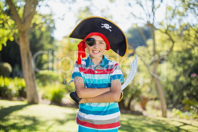 Portrait of boy pretending to be a pirate in the park