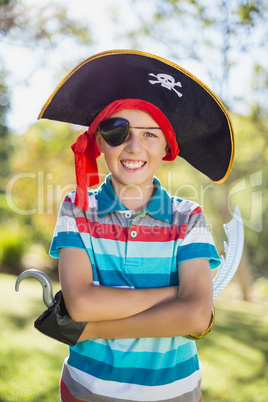 Portrait of boy pretending to be a pirate in the park