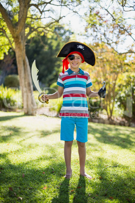 Portrait of boy pretending to be a pirate in the park