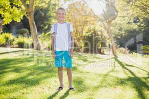 Portrait of smiling boy standing in park