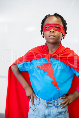 Portrait of boy pretending to be a superhero