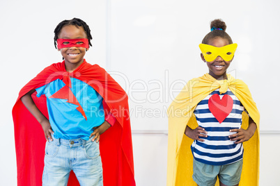 Smiling boy and girl pretending to be a superhero