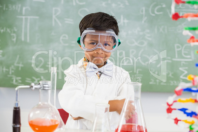 Portrait of schoolboy doing a chemical experiment in laboratory