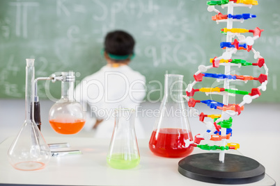 Chemicals beaker and flasks n table in laboratory