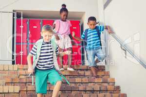 School kids getting down from staircase