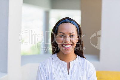 Portrait of smiling school teacher in classroom