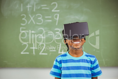 School boy in virtual reality glasses in classroom