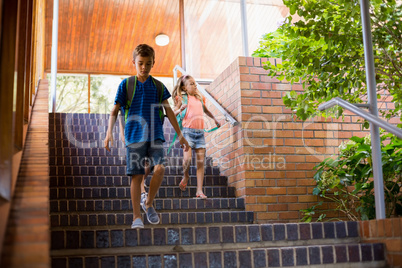 School kids walking on staircase
