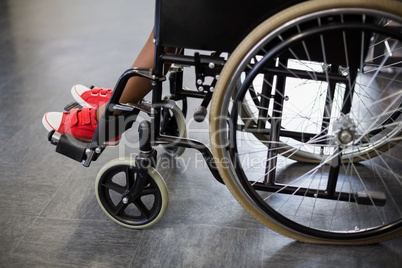 Boy sitting on wheelchair