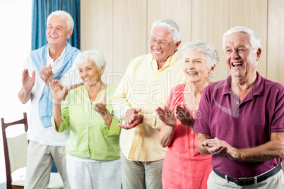 Seniors clapping hands