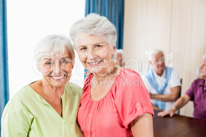 Smiling senior women looking at camera