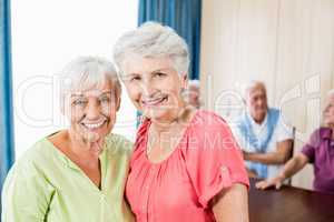 Smiling senior women looking at camera