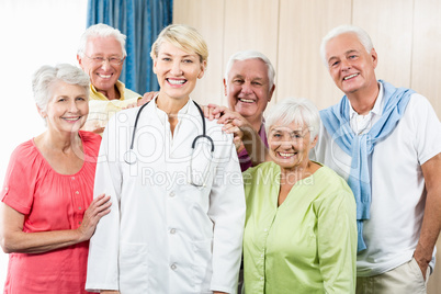 Seniors putting their hands on nurse