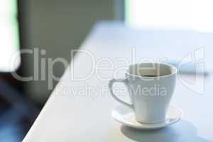Cup of coffee on table