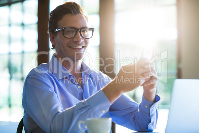 Portrait of man using mobile phone