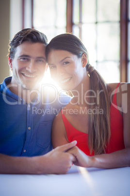 Portrait of young couple embracing each other