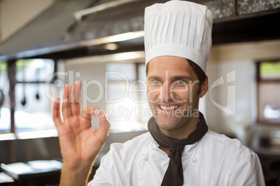 Portrait of happy chef making ok sign