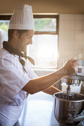 Chef blending the batter in mixing blender