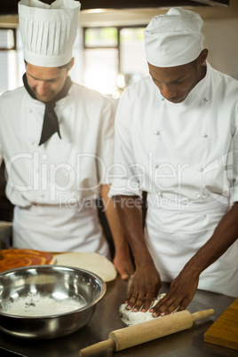 Two chefs making pizza doug