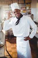Portrait of happy chef making ok sign