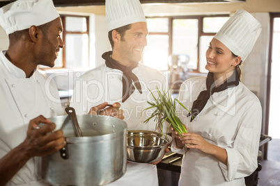 Chefs talking while preparing food