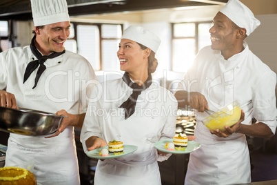 Chefs preparing a dessert