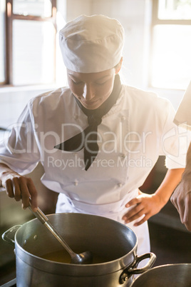 Chef preparing food at stove
