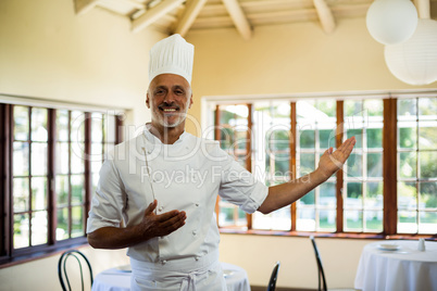 Portrait of smiling chef welcoming