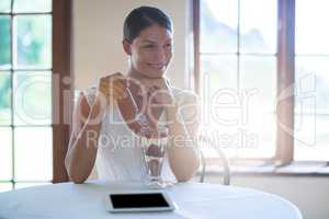 Smiling woman eating dessert