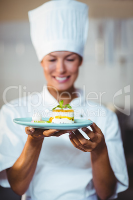 Smiling chef presenting her food