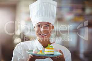 Portrait of chef presenting her food