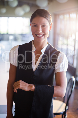 Waitress with napkin draped over her hand