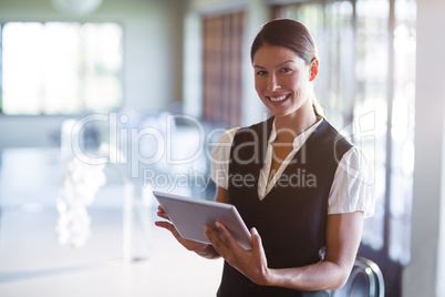 Portrait of smiling waitress writing notes Portrait of smiling waitress writing notes