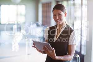 Portrait of smiling waitress writing notes