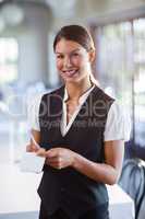 Portrait of smiling waitress taking order