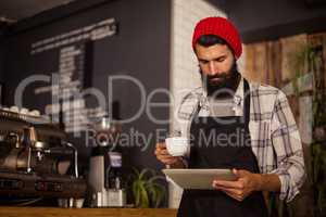 Waiter using a tablet computer