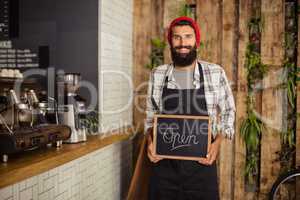 Waiter holding a board written open