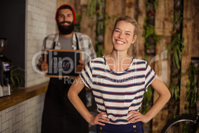 Waiter holding a board written open