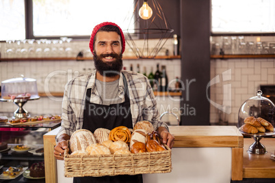 Hipster holding a crate bread