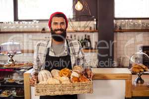 Hipster holding a crate bread