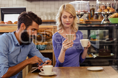 Couple using smartphones