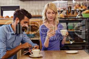 Couple using smartphones